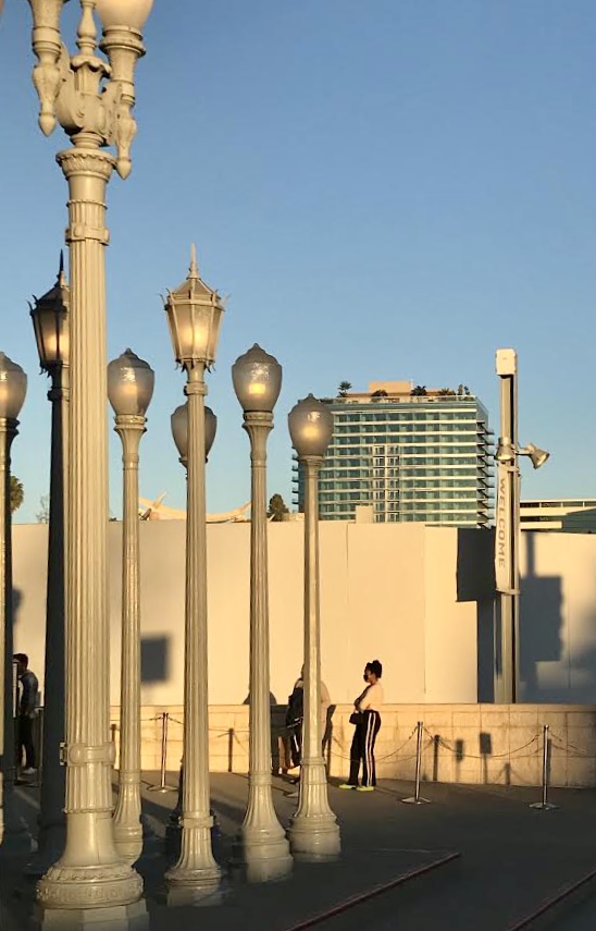 A photo of One Museum Square building, taken from vantage point of Urban Light at LACMA