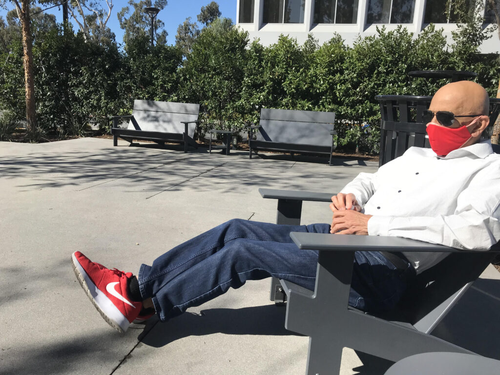 A photo of Hoshi Printer with a red mask and matching shoes