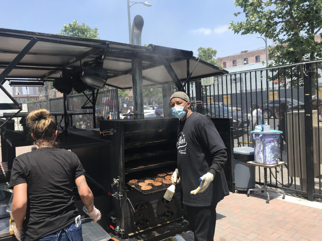 A photo of Warren G working the grill